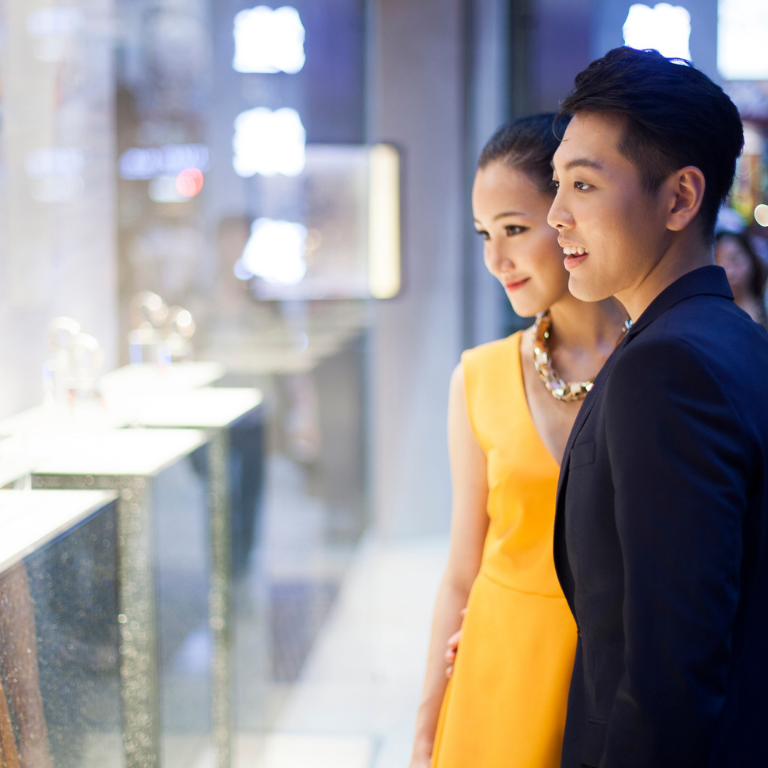 Young couple looking at jewelry in Hong-Kong